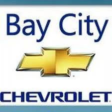Bay City Chevrolet logo featuring the gold Chevrolet bowtie emblem and blue text on a white background.
